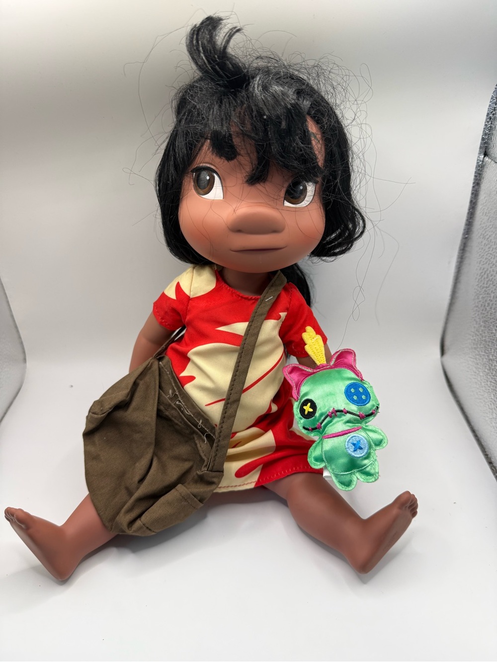 Disney Brown-Skinned Doll with Red & Cream Dress and Green Plush Companion